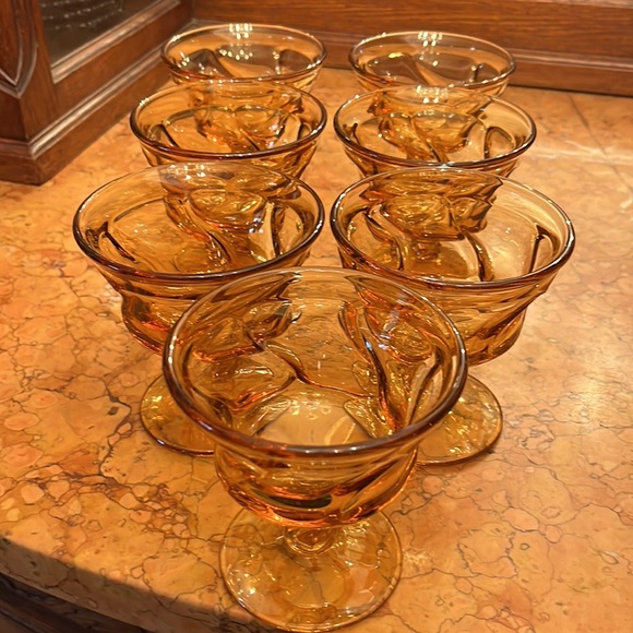 7 matching amber drinking/dessert glasses